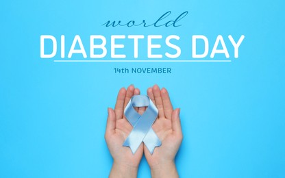 Image of World Diabetes Day. Woman holding light blue ribbon on color background, top view. Banner design