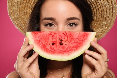 Photo of Beautiful young woman with watermelon on pink background, closeup