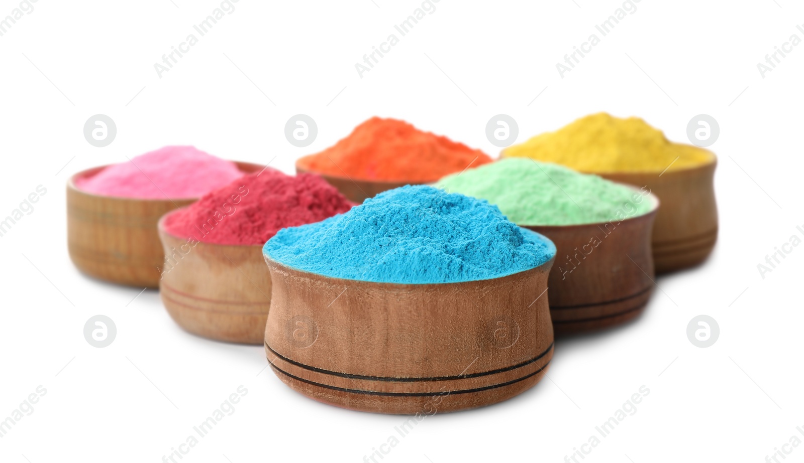 Photo of Colorful powder dyes in bowls on white background. Holi festival