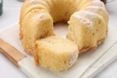 Photo of Delicious freshly baked sponge cake on white table, closeup