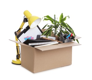 Photo of Cardboard box full of office stuff on white background