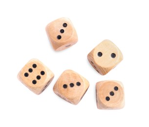 Photo of Many wooden game dices isolated on white, top view