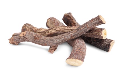 Photo of Dried sticks of liquorice root on white background