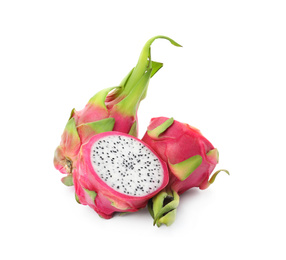 Photo of Delicious cut and whole dragon fruits (pitahaya) on white background