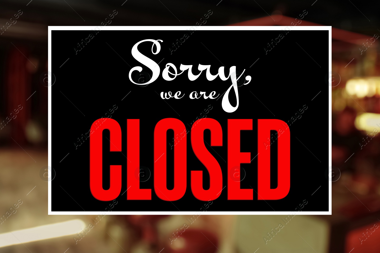 Image of Sorry we are closed sign against blurred background