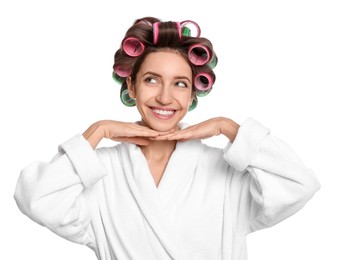 Photo of Beautiful young woman in bathrobe with hair curlers on white background
