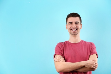 Photo of Charming young man on color background