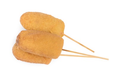 Delicious deep fried corn dogs isolated on white, top view