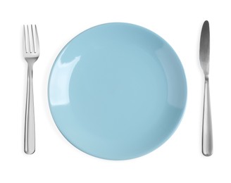 Photo of Plate, fork and knife on white background, top view