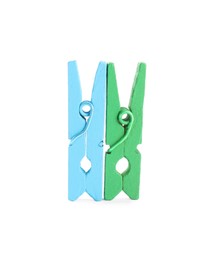 Photo of Two colorful wooden clothespins on white background