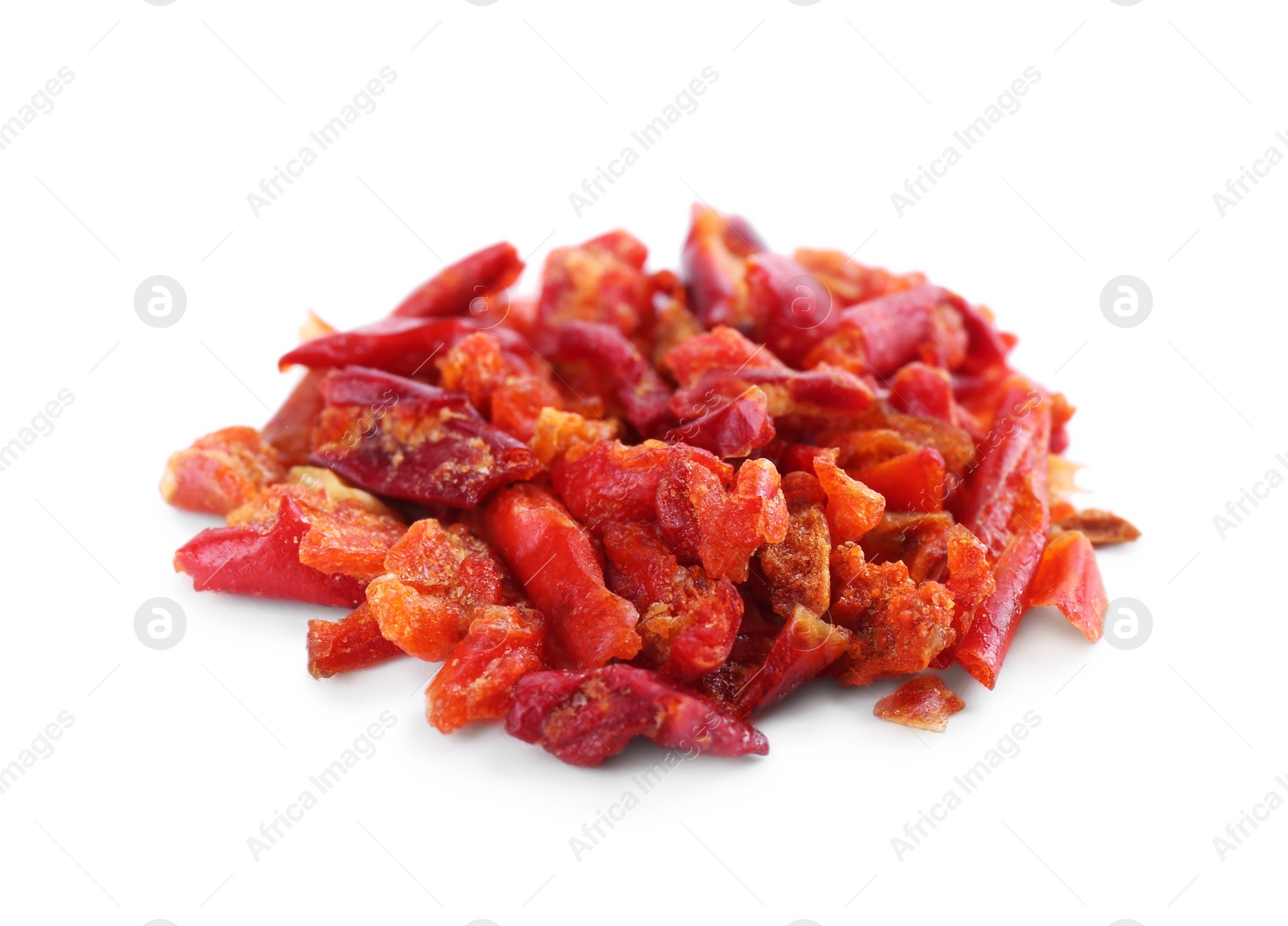 Photo of Aromatic spice. Red chili pepper flakes isolated on white