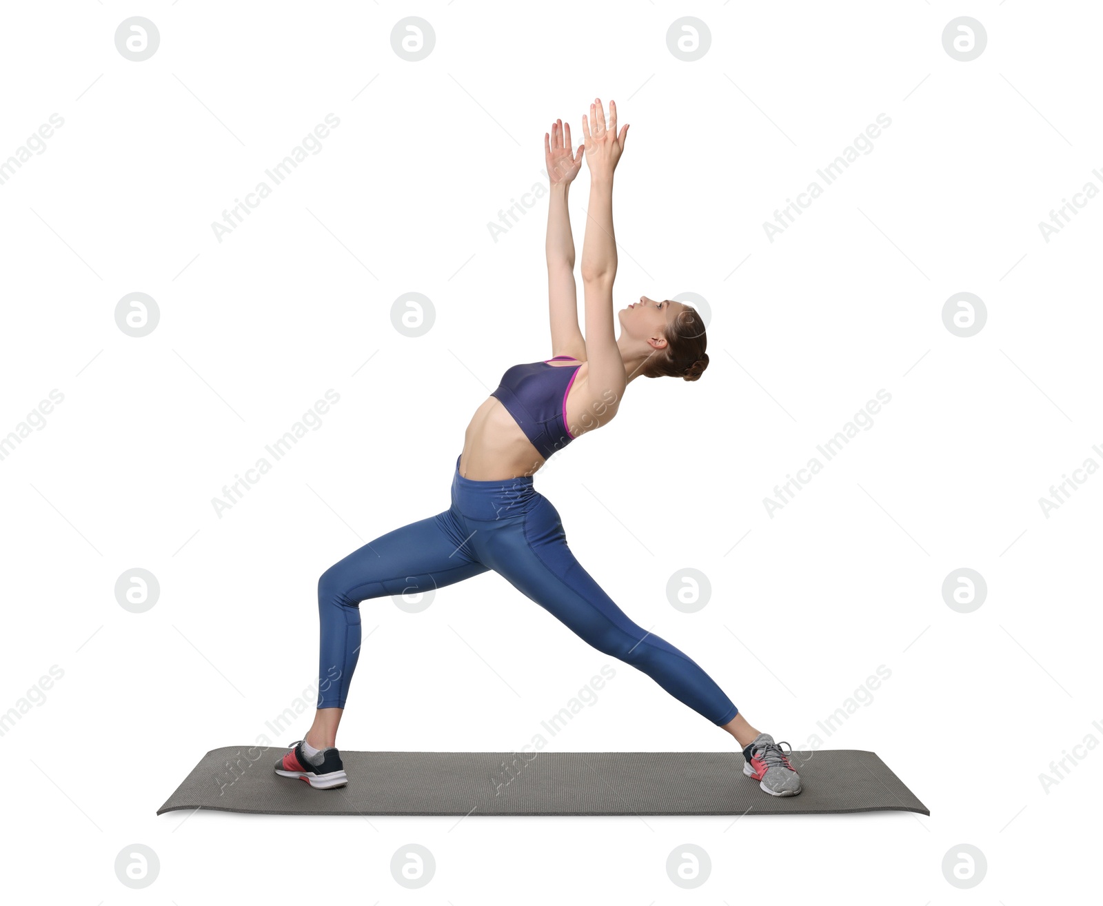 Photo of Young woman practicing yoga on white background