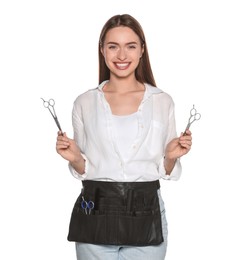 Photo of Portrait of happy hairdresser with professional scissors on white background