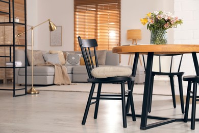 Spacious apartment interior with table and comfortable sofa