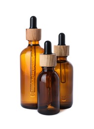 Photo of Different bottles of essential oil on white background