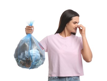 Photo of Woman holding full garbage bag on white background