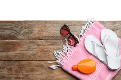 Photo of Beach accessories on wooden table, flat lay. Space for text