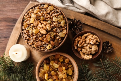 Photo of Traditional Christmas slavic dish kutia served on wooden table, top view