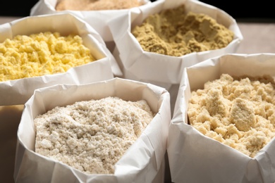 Photo of Different types of flour in paper bags