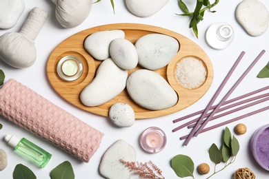 Photo of Composition with spa stones on white background, top view
