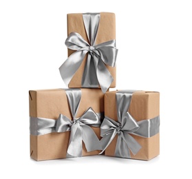 Photo of Beautifully wrapped gift boxes on white background