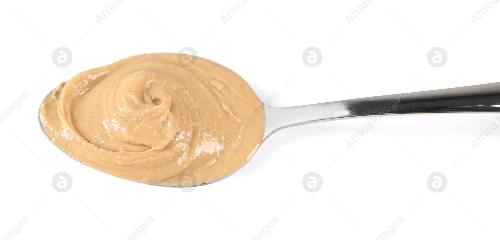 Photo of Delicious nut butter in spoon isolated on white