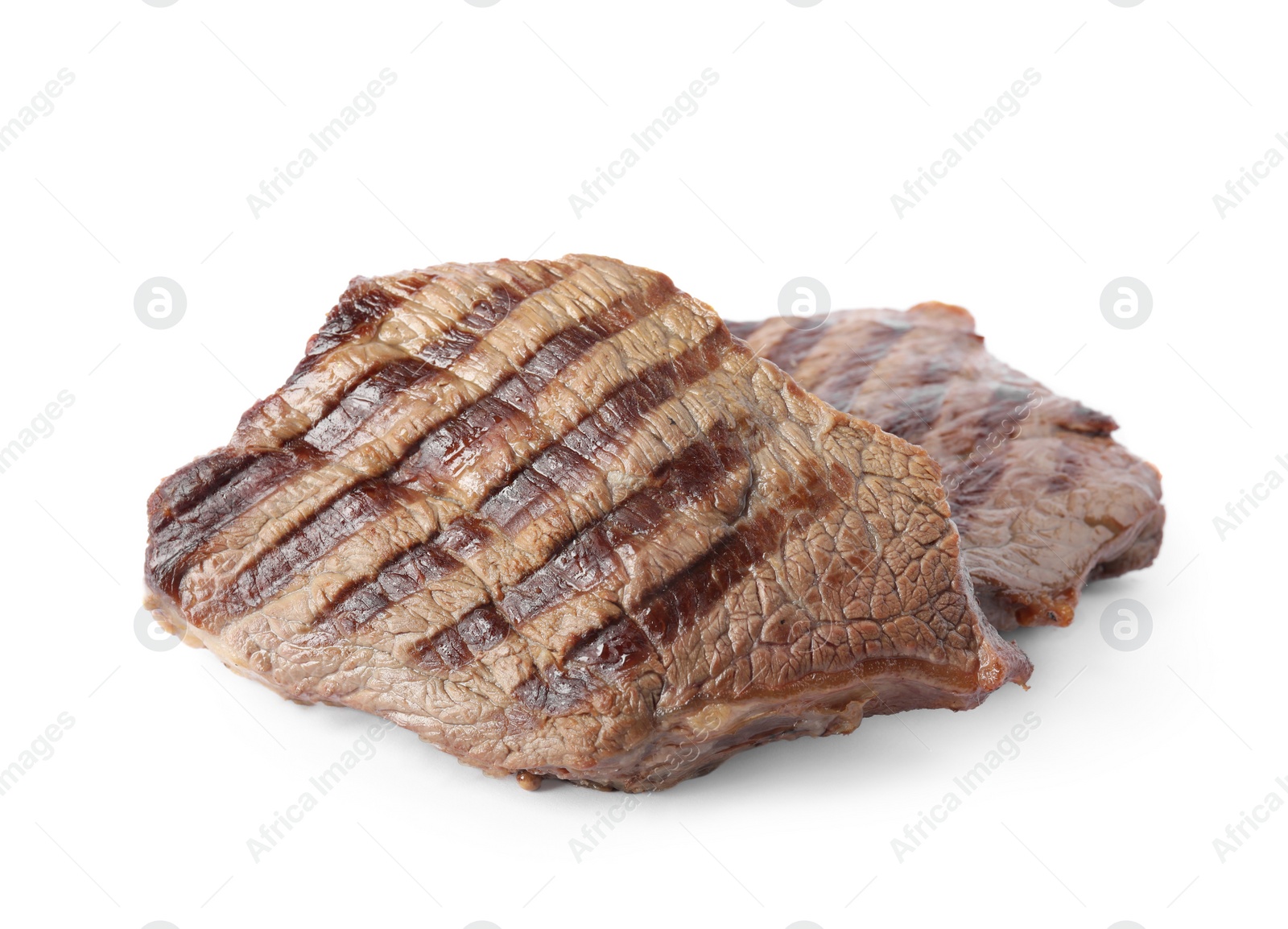 Photo of Delicious grilled beef steaks isolated on white