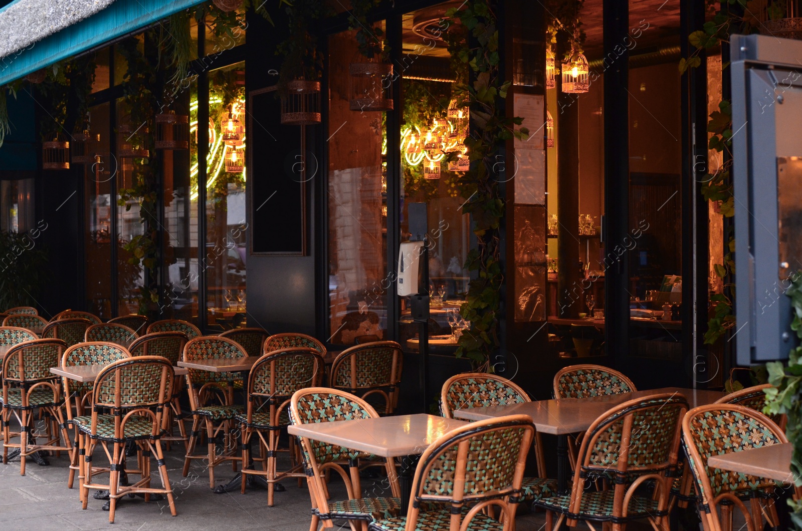 Photo of Outdoor cafe with rattan chairs and tables