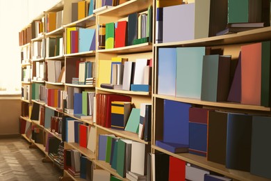 Image of Collection of different books on shelves in library