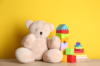 Photo of Set of different toys on wooden table