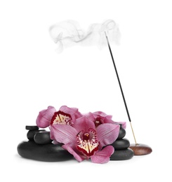 Photo of Incense stick smoldering in holder near orchid flowers and spa stones on white background
