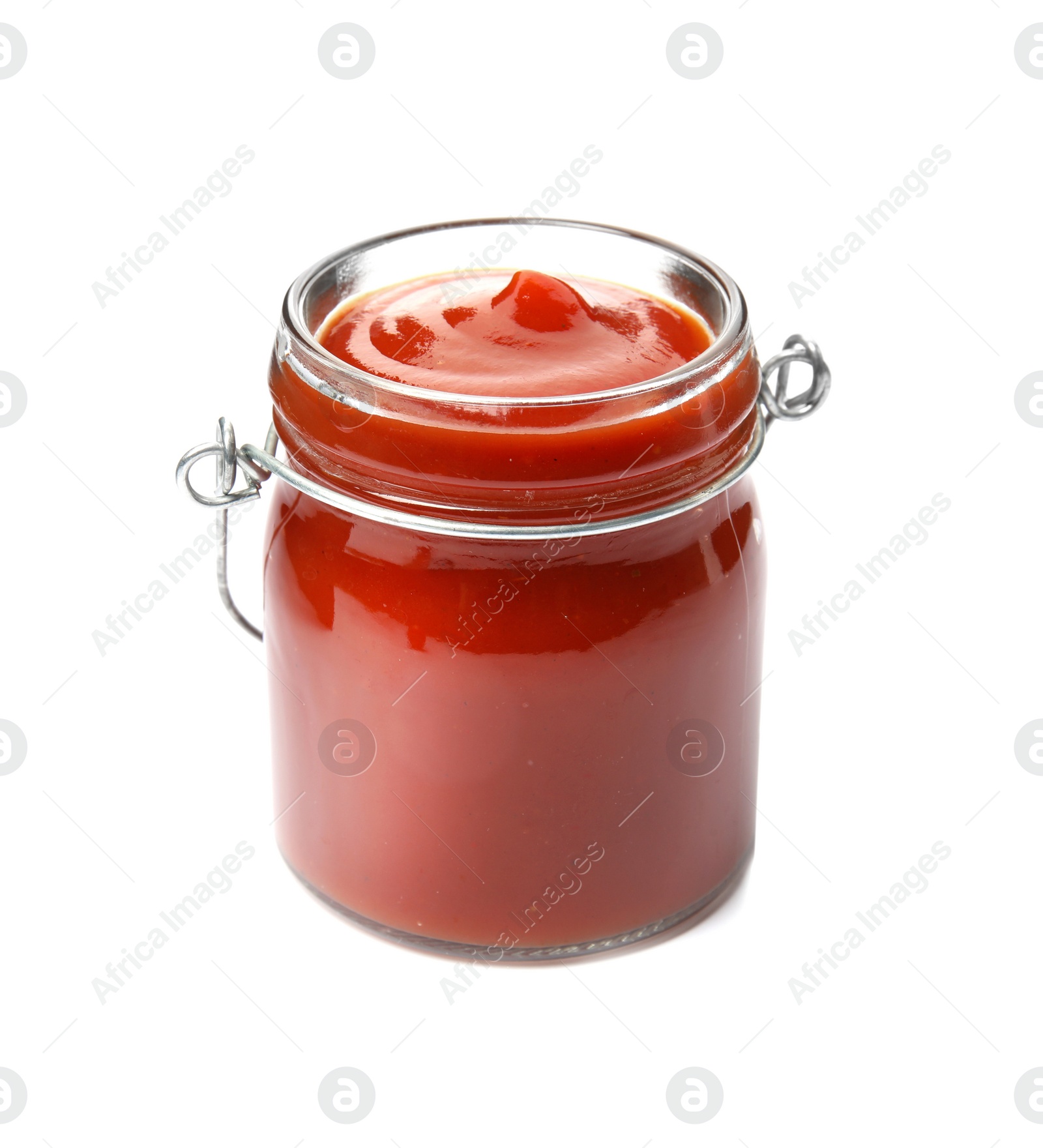 Photo of Tasty homemade tomato sauce in glass jar on white background