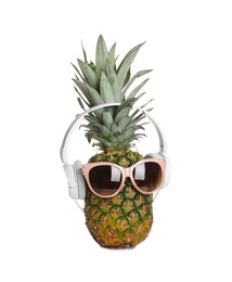 Funny pineapple with headphones and sunglasses on white background