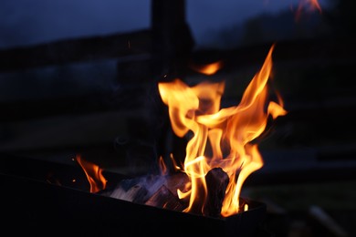 Photo of Beautiful view of bonfire outdoors in evening