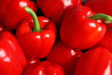 Photo of Many ripe red bell peppers as background, top view