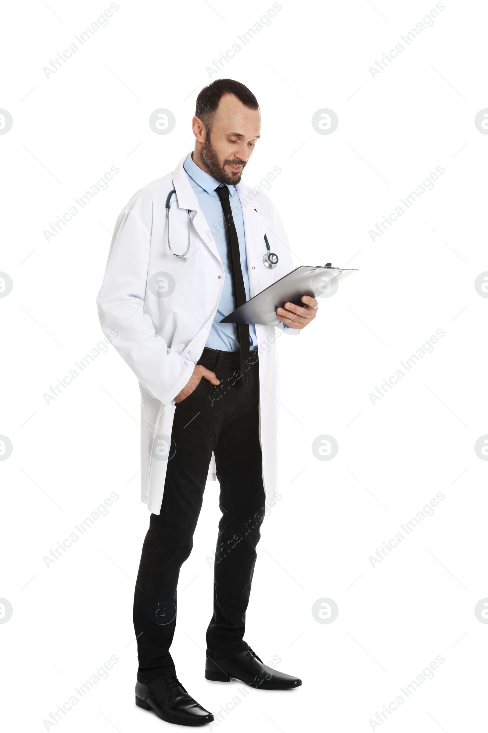 Photo of Full length portrait of male doctor with clipboard isolated on white. Medical staff