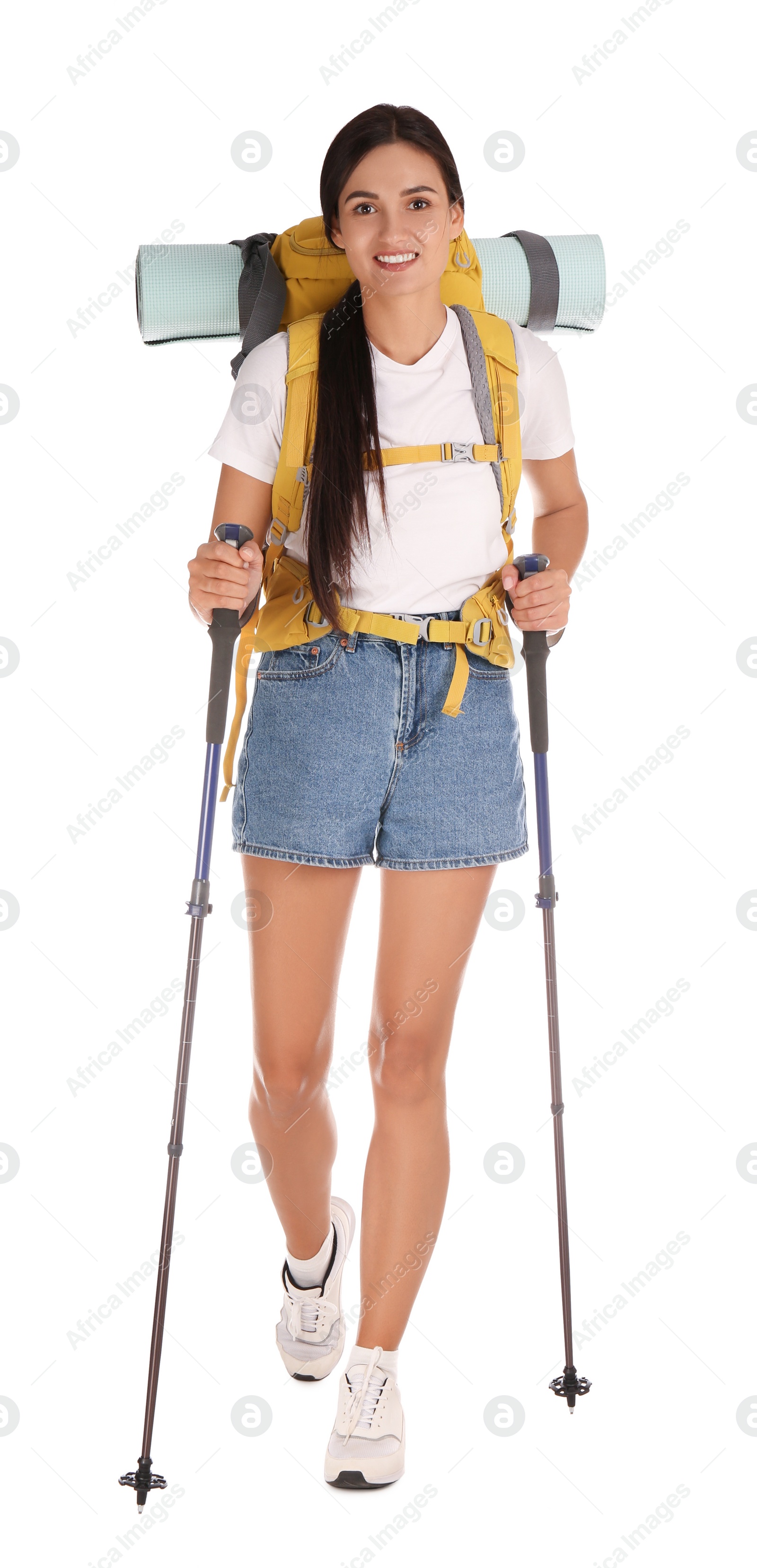 Photo of Female hiker with backpack and trekking poles on white background