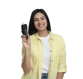 Photo of Happy woman with breathalyzer on white background