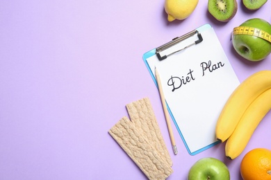 Flat lay composition with clipboard, healthy food, measuring tape and space for text on color background. Weight loss concept