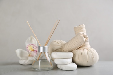 Beautiful spa composition with stones and flower on table