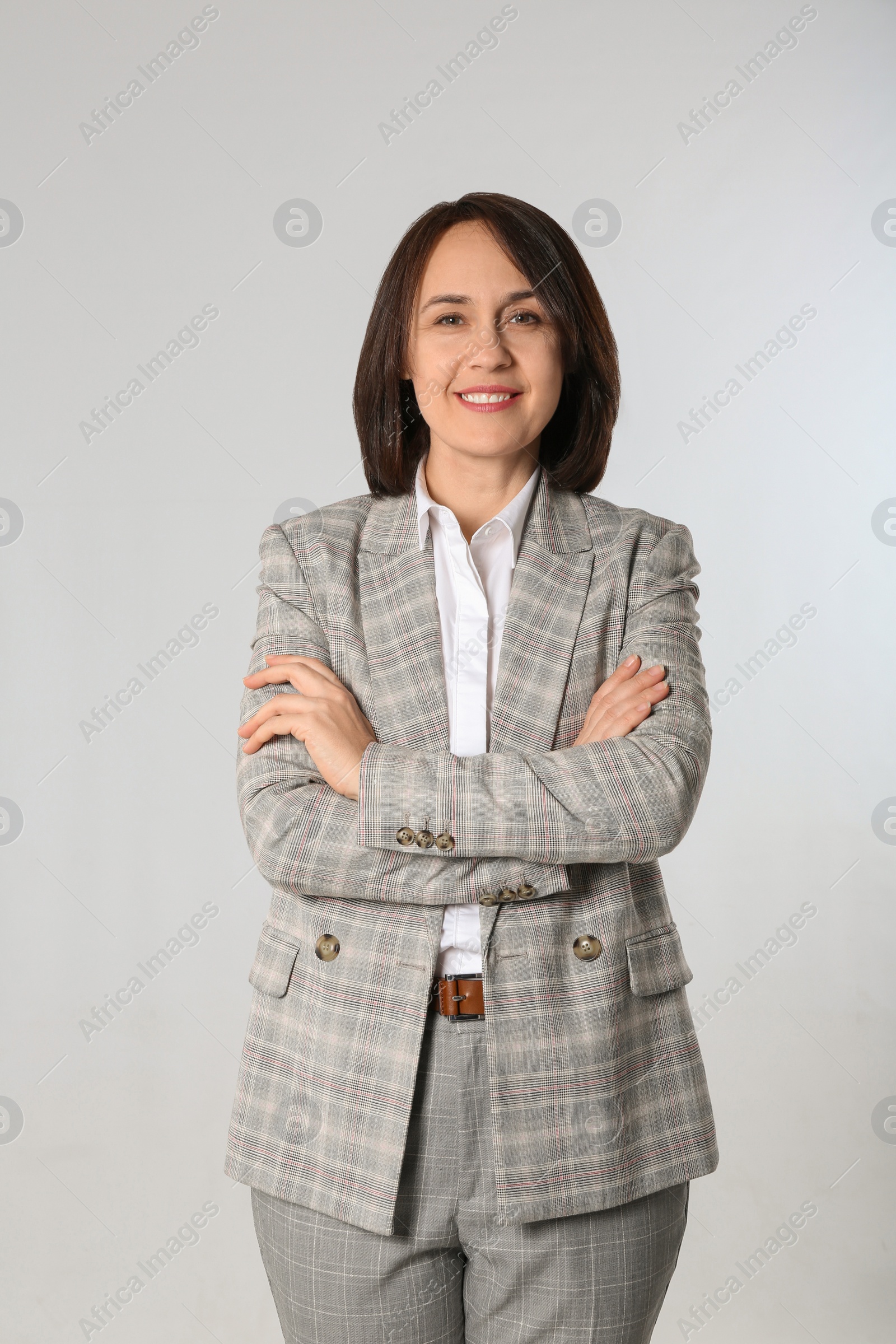 Photo of Portrait of mature businesswoman on light grey background