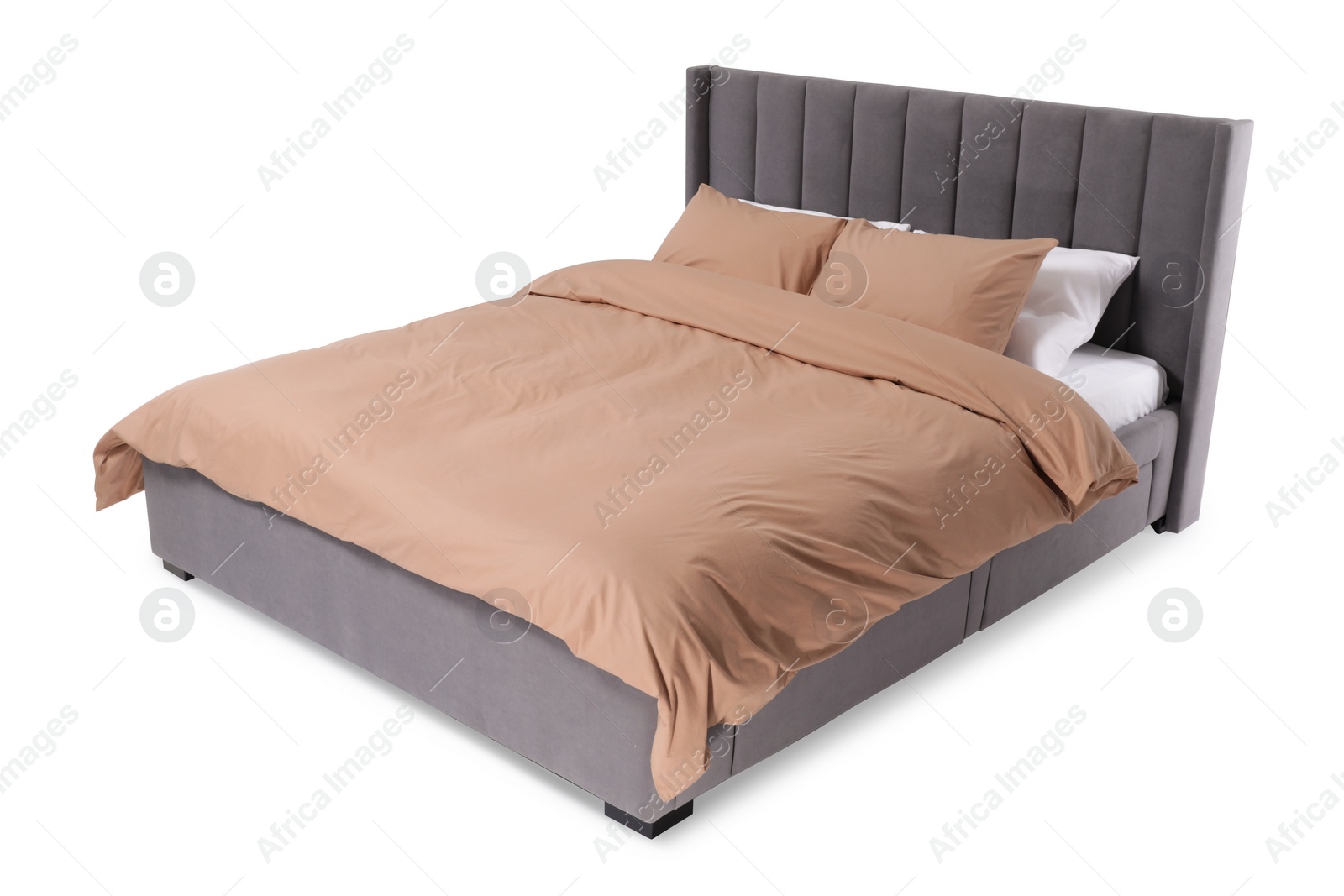 Photo of Comfortable gray bed with beige linens on white background