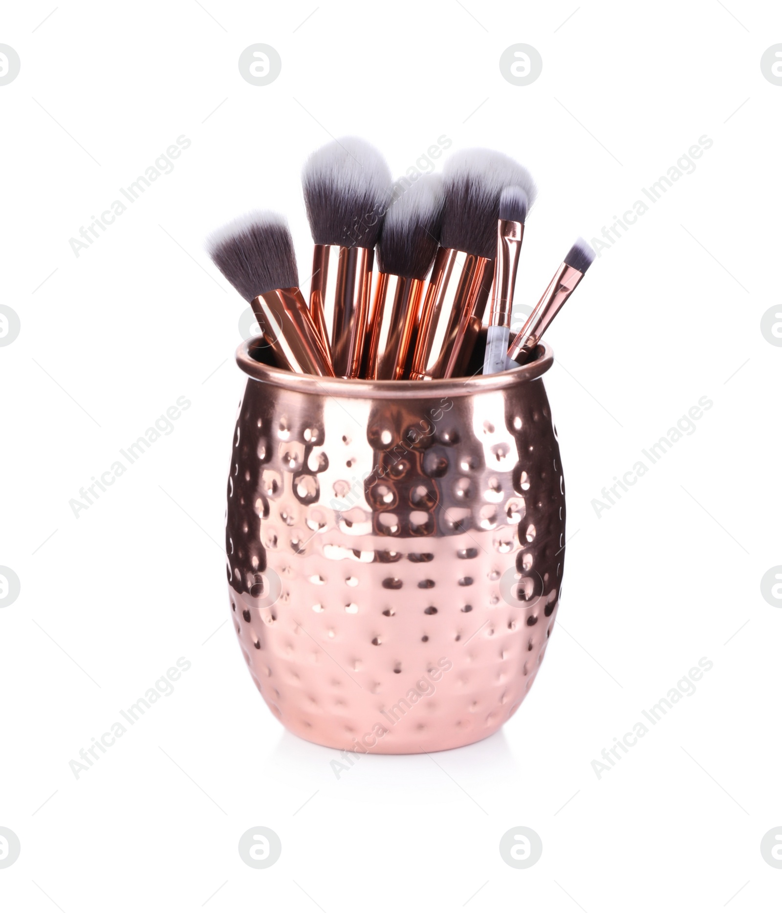 Photo of Holder with professional makeup brushes isolated on white