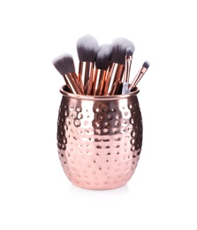Photo of Holder with professional makeup brushes isolated on white