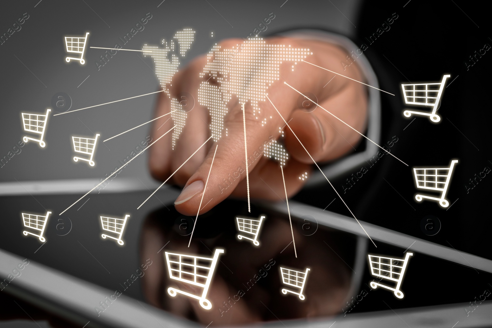 Image of Woman using tablet for online purchases on gray background, closeup. Illustration of world map and shopping cart icons above device screen