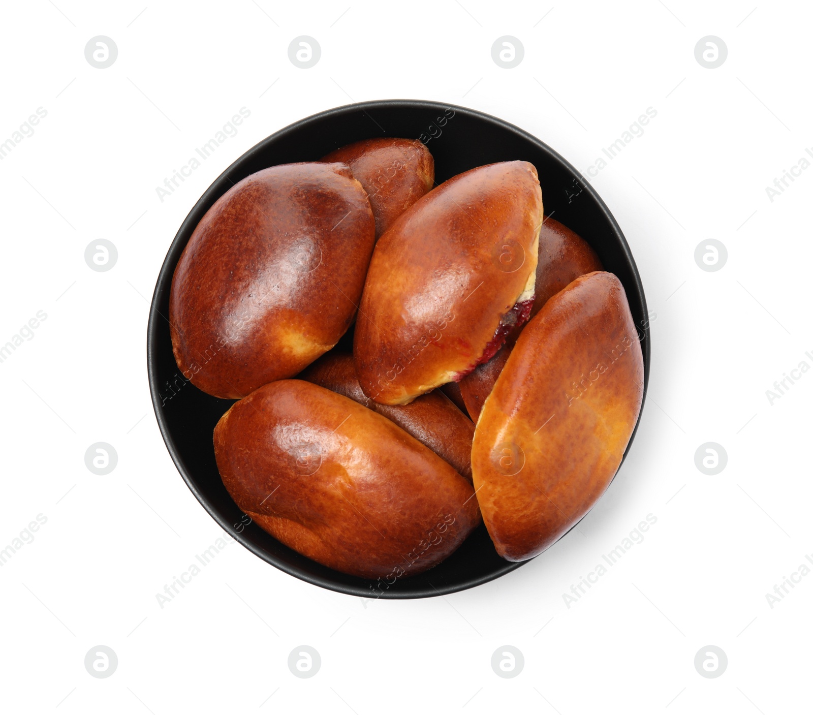 Photo of Bowl with delicious baked pirozhki on white background, top view