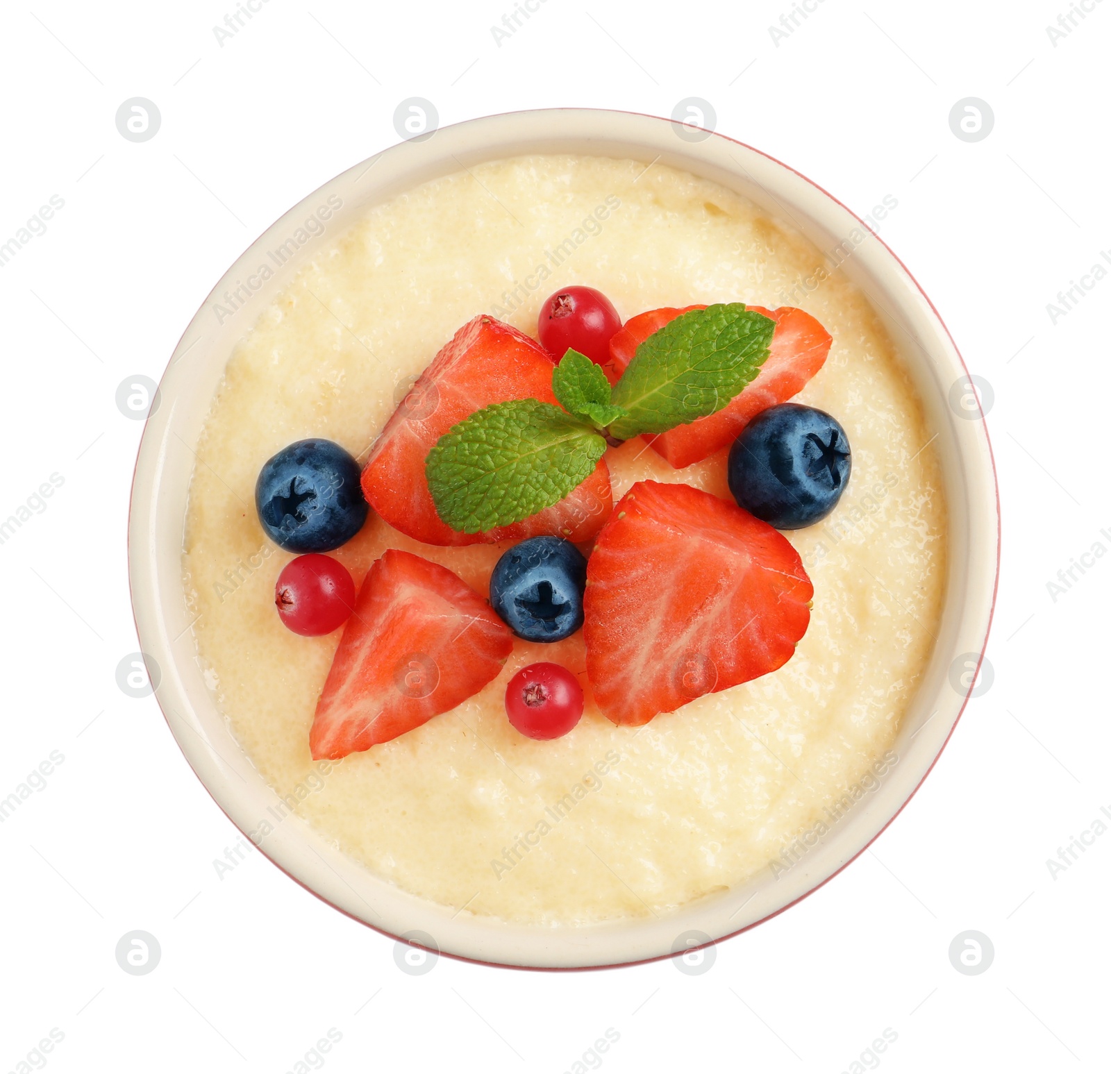 Photo of Delicious semolina pudding with berries and mint on white background, top view