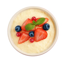 Delicious semolina pudding with berries and mint on white background, top view