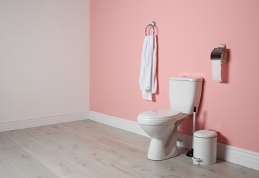 Photo of New ceramic toilet bowl in modern bathroom