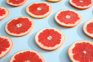 Fresh sliced ripe grapefruit on color background